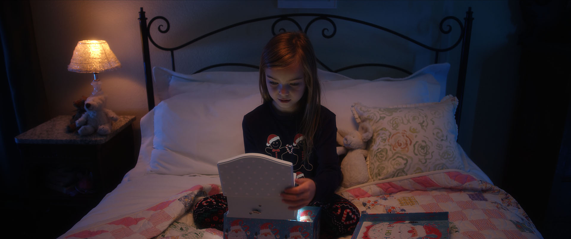 frame grab of a girl on a bed from a Marilyn York commercial
